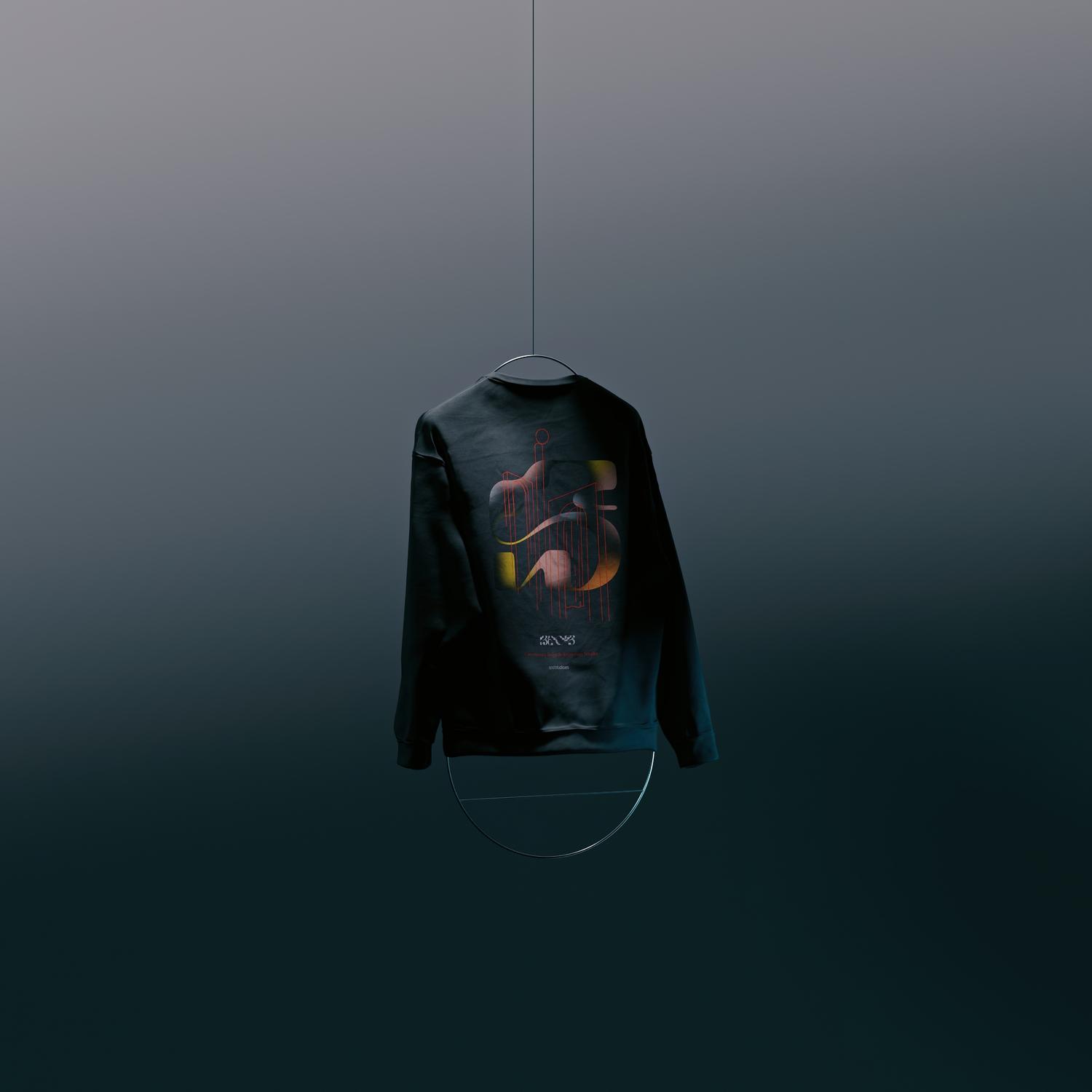Sweatshirt with abstract design hangs from a wire against a gradient blue background, viewed from the back in a studio setting.