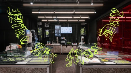 CGI retail store interior featuring glass display cases and neon yellow digital graffiti by Golgotha