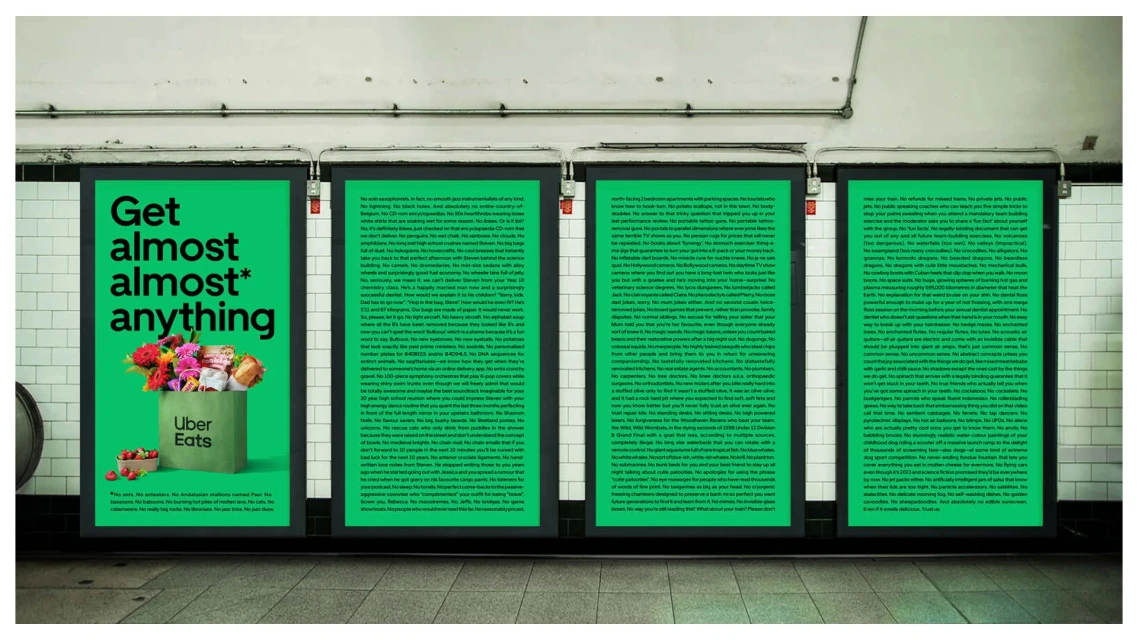 Uber Eats advertising poster inside a subway station featuring food items and the company logo on a lime-green background.