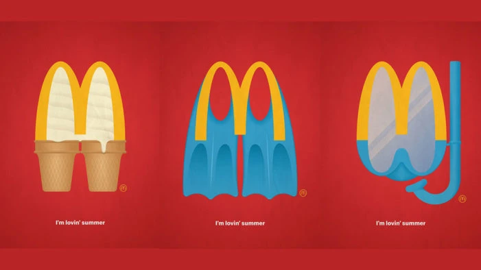 McDonald's summer promotion: Ice cream cone, swim fins, and snorkel mask arranged to resemble the Golden Arches logo on a red background.