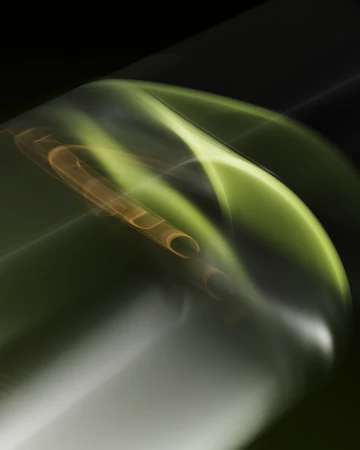 Abstract blurred motion of green and brown light trails against a dark background, creating a dynamic and ethereal visual effect.
