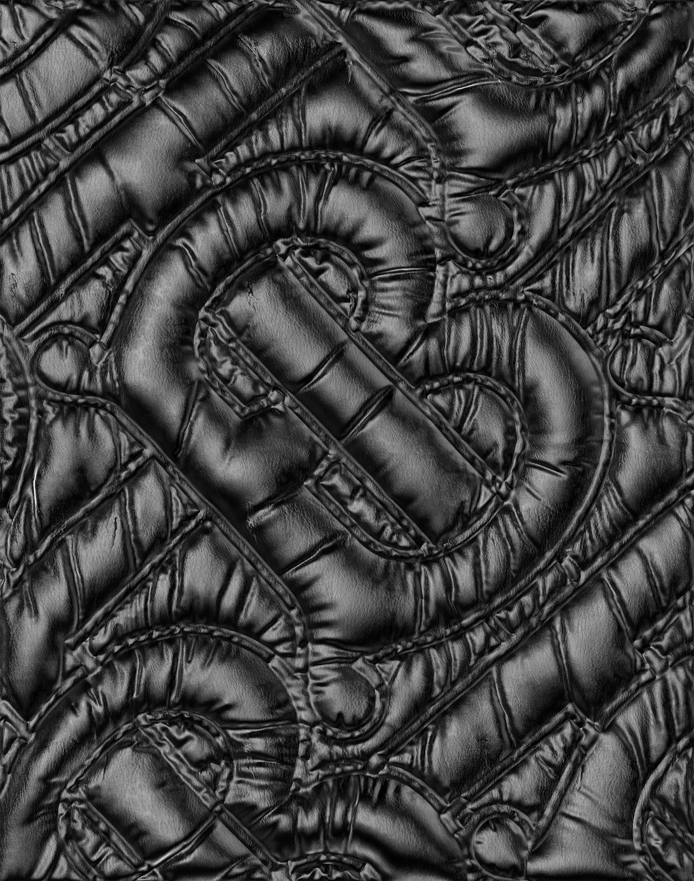 Close-up of a black quilted surface with a repeating embossed pattern creates a luxurious, textured background with dark and shadowed tones.