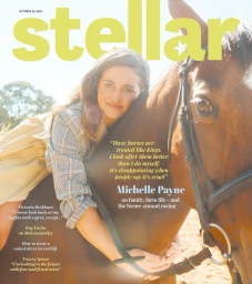 Michelle Payne embracing a brown horse outdoors in a magazine cover portrait by Michelle Payne