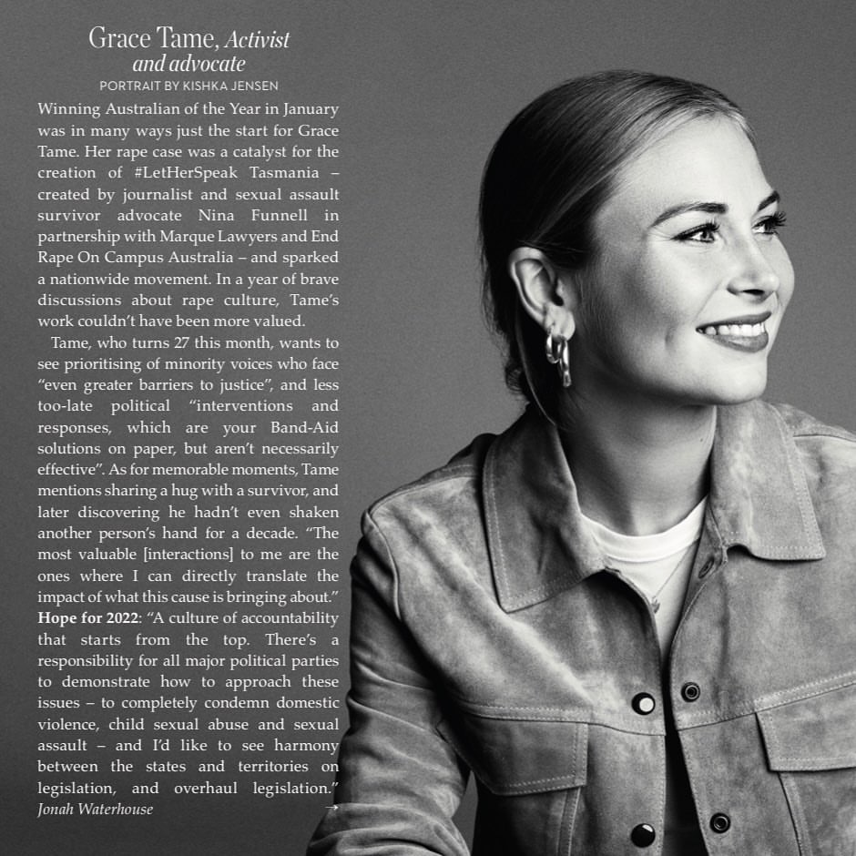 Black and white portrait of Grace Tame in a suede jacket, smiling slightly, with natural light highlighting her features and simple jewelry.