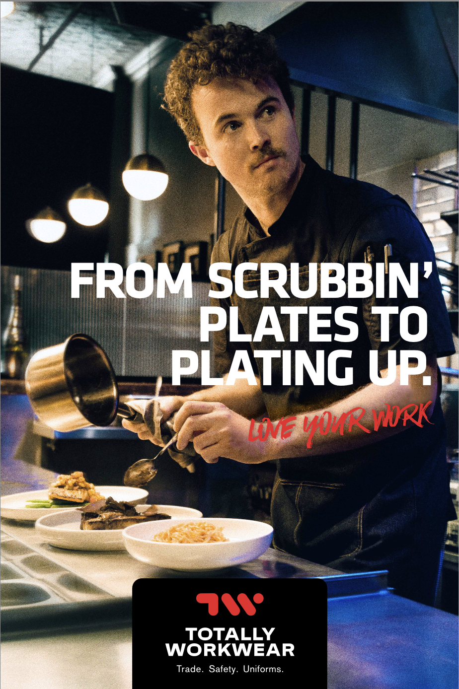 Professional chef plating food in a commercial kitchen, wearing workwear, emphasizing culinary expertise in a restaurant setting.