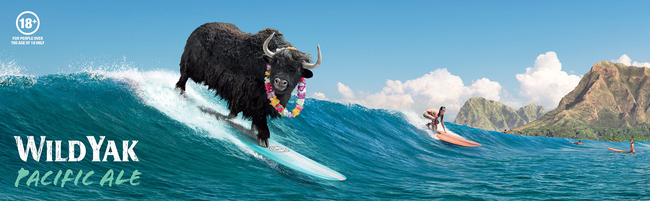 A yak with a flower lei is surfing on a wave with a woman surfer in the background, set against a backdrop of mountains and sky.