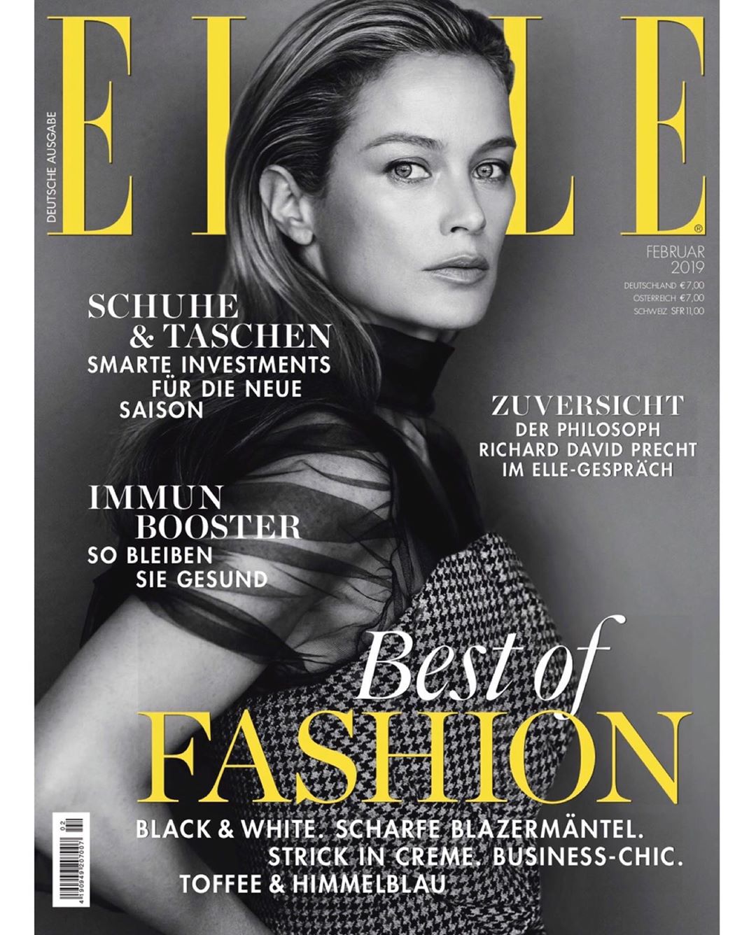 Elle magazine cover featuring a woman with blonde hair and a black and white houndstooth jacket, with the magazine's title prominently displayed.