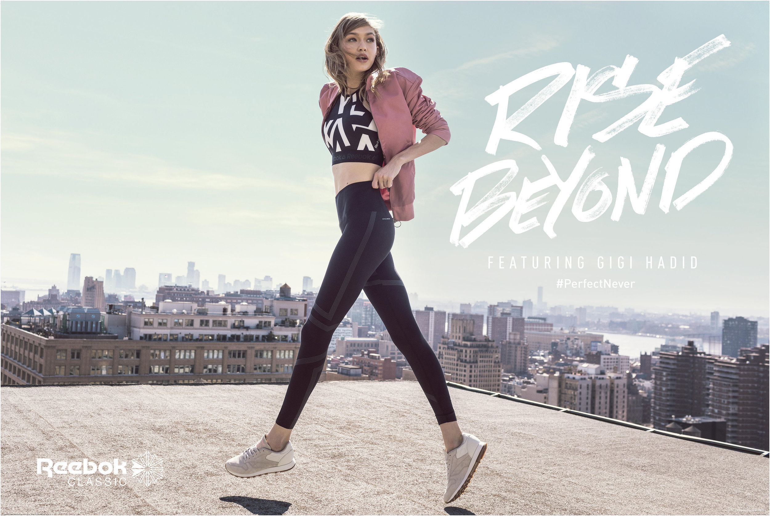 Athletic woman in sports bra and leggings walking on a rooftop against a city skyline with the Reebok logo and text overlay.