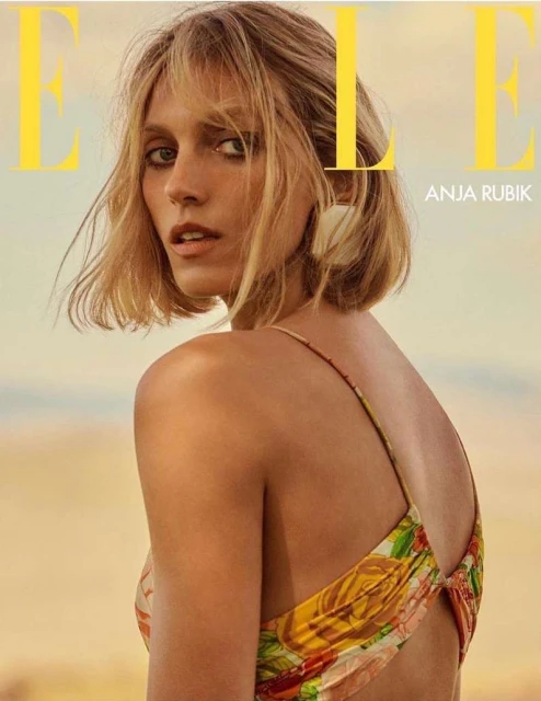 Elle magazine cover featuring Anja Rubik, showcasing fashion and beauty against a soft, neutral background with prominent masthead.