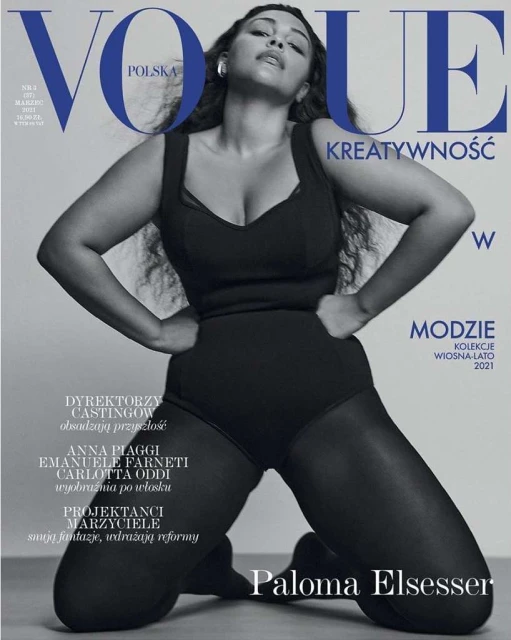 Vogue Polska cover features Paloma Elsesser in a black bodysuit and sheer tights, posing against a gray backdrop with magazine text.