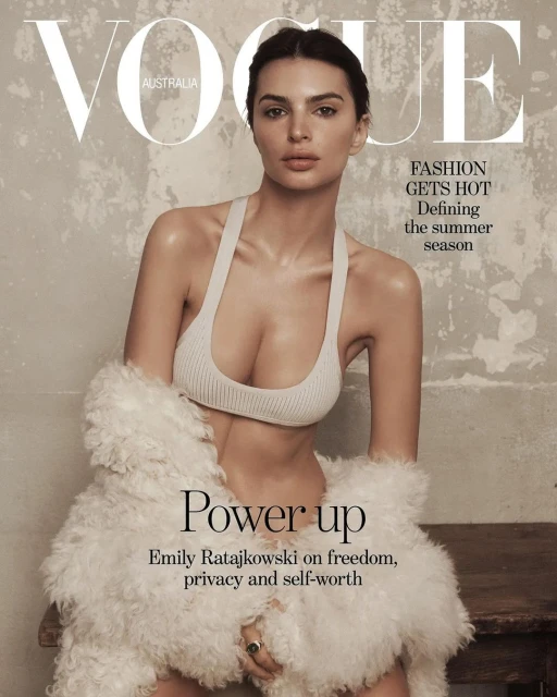 Vogue Australia cover featuring Emily Ratajkowski in a light-colored top and white furry jacket, with a neutral background and magazine text.