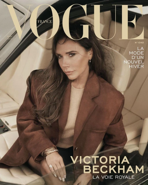 Victoria Beckham on the cover of Vogue France, wearing a brown jacket in a car interior, promoting the latest winter fashion trends.