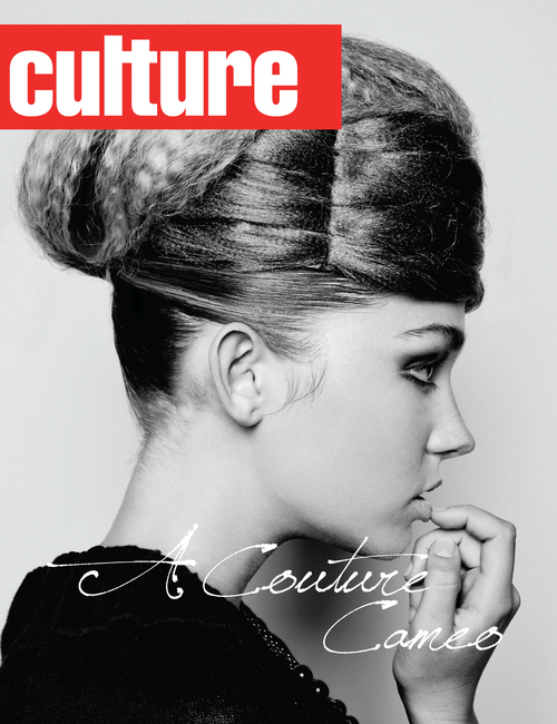 Black and white fashion portrait of a young woman with a high bun hairstyle, wearing a dark top, as seen on the cover of CULTURE magazine.