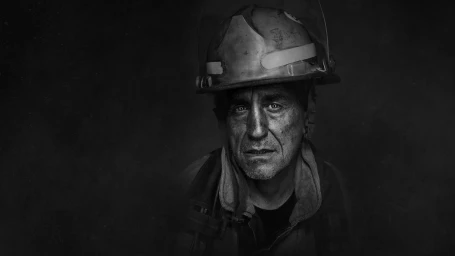 Portrait of a firefighter in a helmet with smudged face in dramatic low-key lighting by Tom Franks.