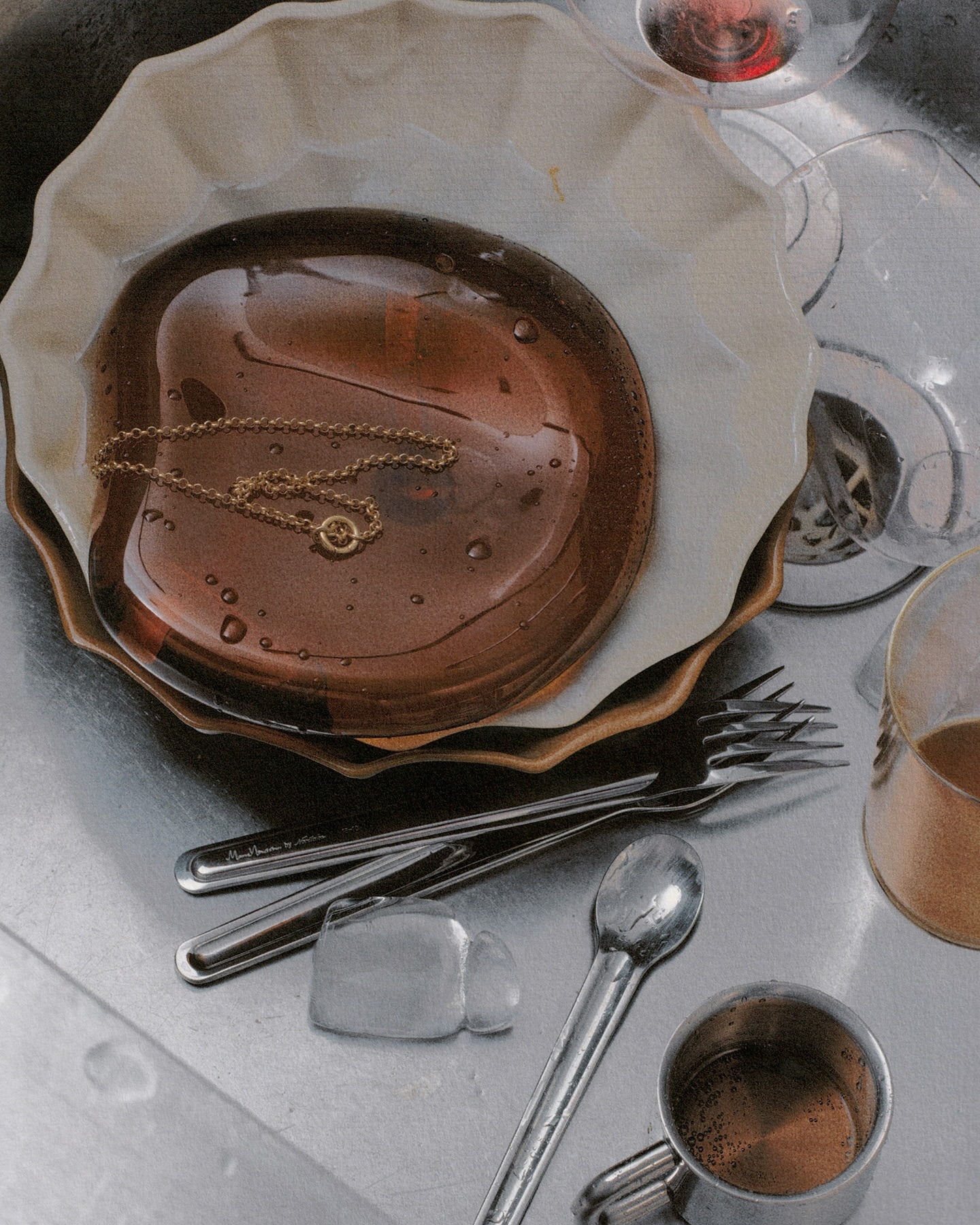Still life of a brown plate with a gold necklace, forks, spoons, and a metal mug in a stainless steel sink with running water.