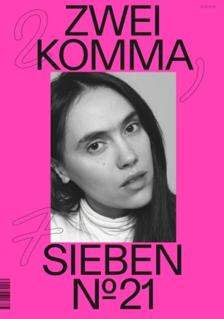 Portrait of a woman with dark hair in a white turtleneck against a bright pink typographic poster background.