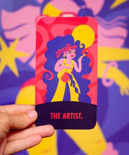 Illustration of a woman artist in yellow overalls holding a paintbrush and paint can, set against an abstract background with the text 'The Artist'.