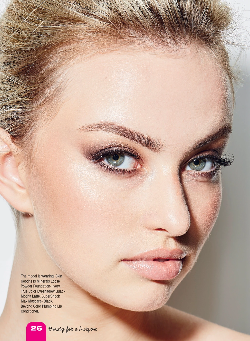 Close-up portrait of a woman with blonde hair, neutral eyeshadow, and light pink lips photographed by Julie Crespel.