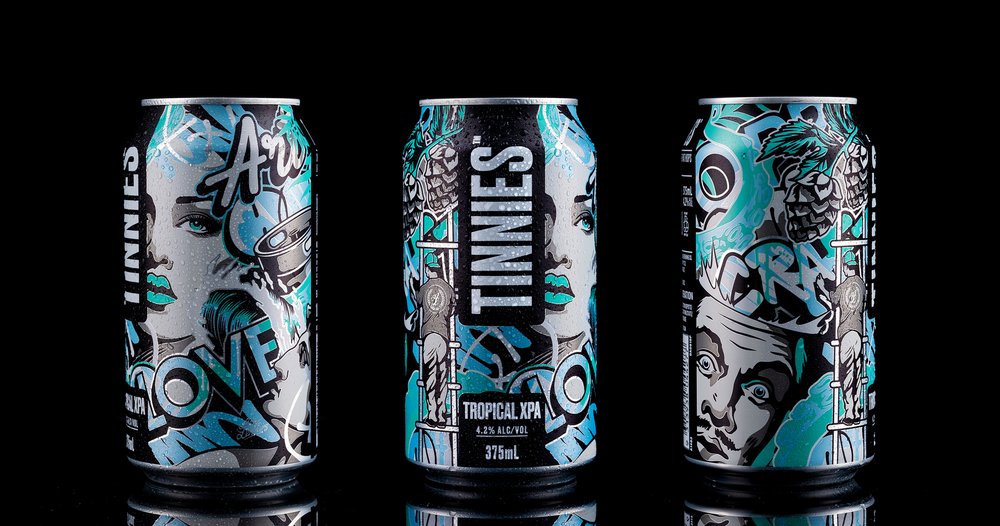 Three aluminum beer cans with creative art deco graphics and a black background, featuring a beverage product with unique artwork.