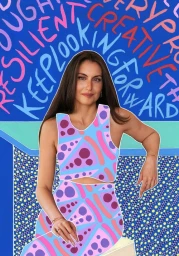 Portrait of a woman wearing a blue and pink patterned two-piece outfit against a vibrant illustrated blue background by Naomi Vona.