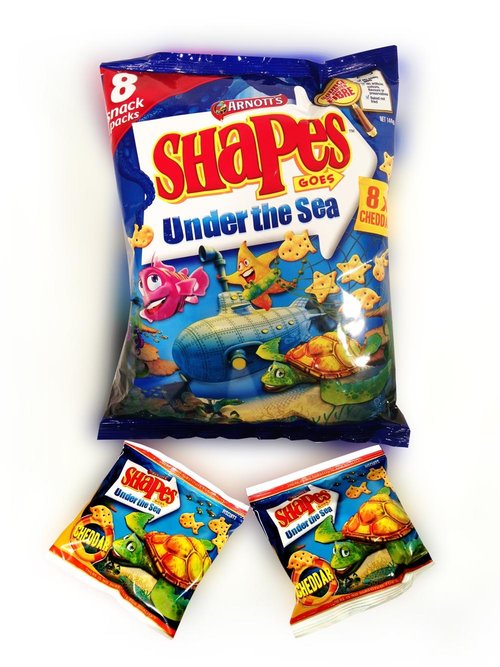 A package of Arnott's Shapes 'Under the Sea' crackers with cartoon sea-life illustrations, accompanied by two smaller snack packs.