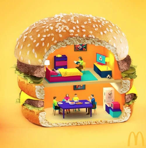 Creative image of a hamburger shaped like a dollhouse with tiny people inside, and colorful miniature furniture and decor.