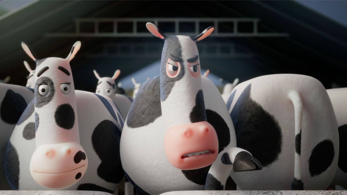 Animated image features several black-and-white cows inside a barn, focusing on two cows with distinctive expressions and features.