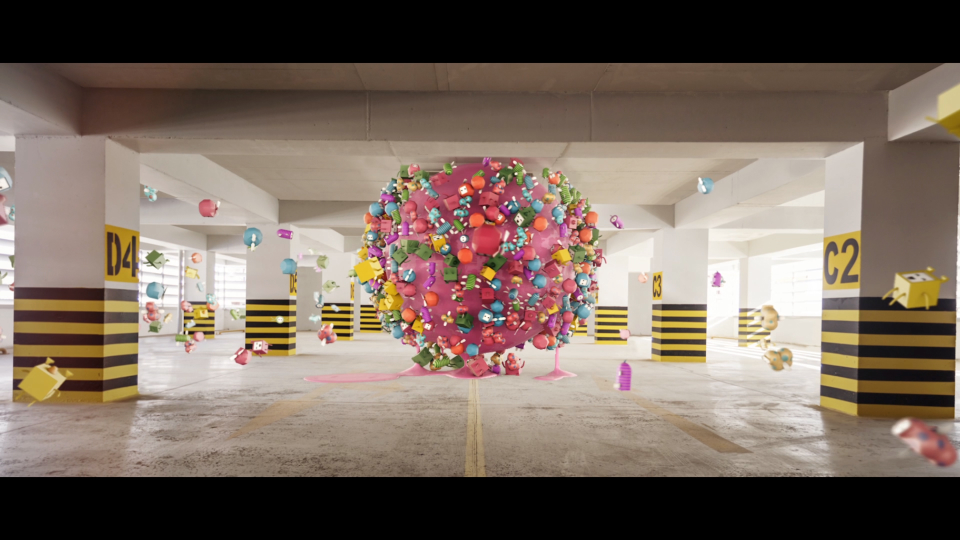 Abstract composition featuring a pink sphere covered in colorful shapes in a parking garage, surrounded by floating geometric elements.