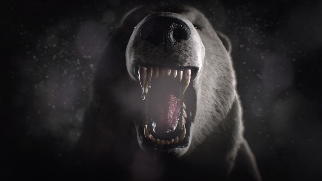 Dramatic close-up of a roaring polar bear with visible teeth, set against a dark, blurred background, creating a menacing and impactful image.