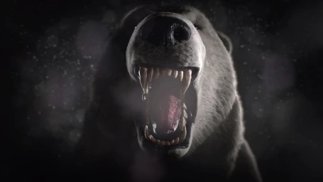 Close-up of a roaring bear with sharp exposed teeth and glistening saliva, shot in dramatic low-key lighting against a dark moody background