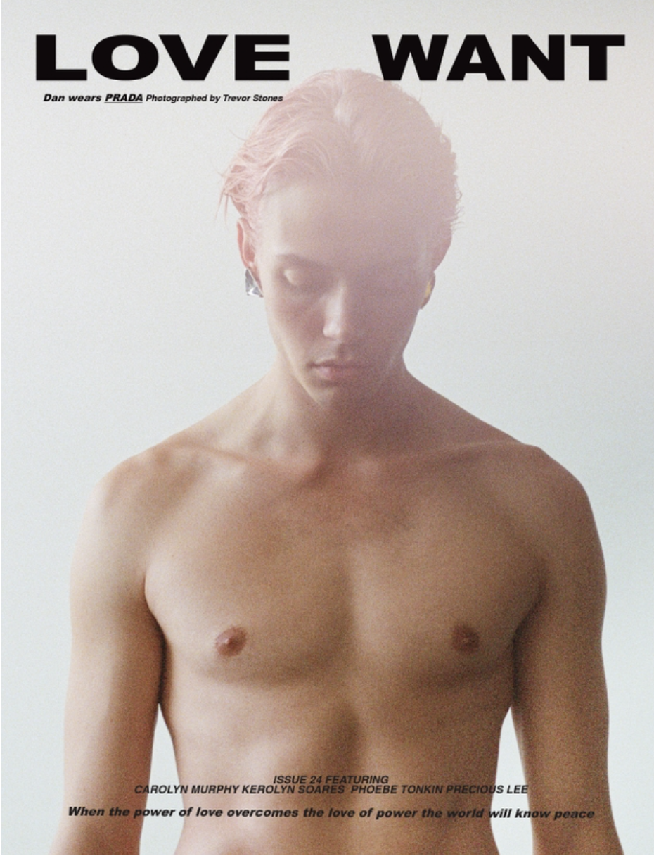 Magazine cover features a chest-up studio shot of a young adult male with pink hair, against a plain white backdrop. Fashion aesthetic.