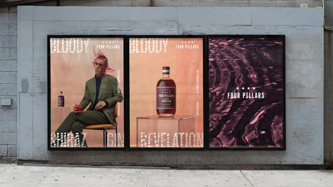 Outdoor billboard advertisement features a man, liquor bottle, and abstract water pattern for Four Pillars Bloody Shiraz Gin.
