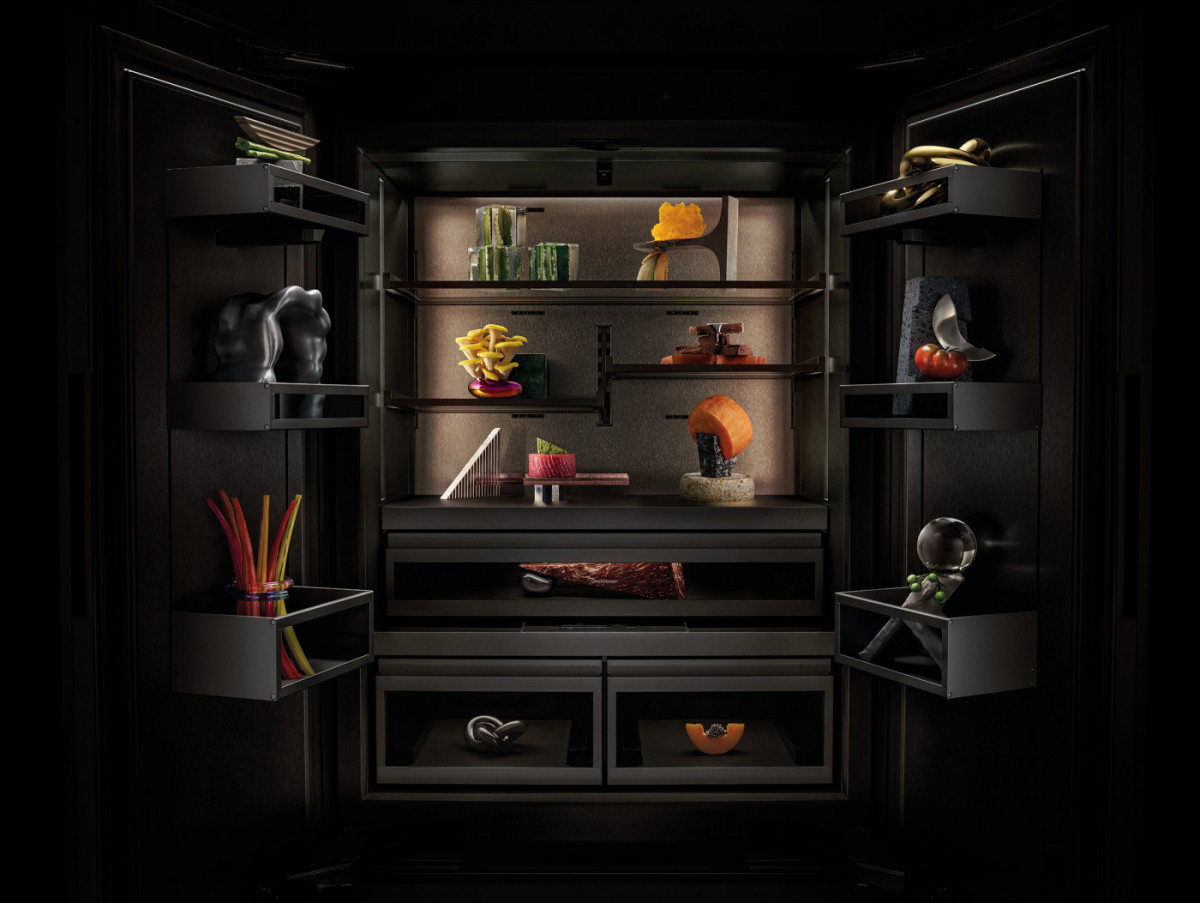 A refrigerator interior displays a diverse range of food items and decorative objects, illuminated by built-in lighting.