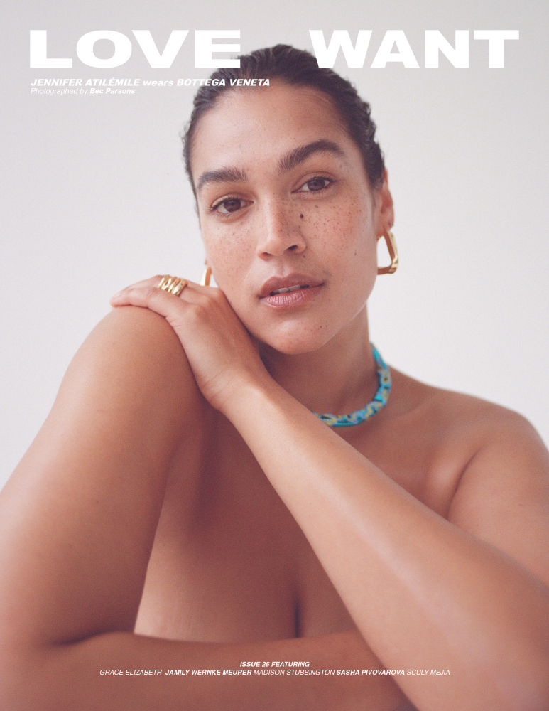 Close-up portrait of Jennifer Atilemile wearing a Bottega Veneta necklace and gold hoop earrings on a light backdrop.