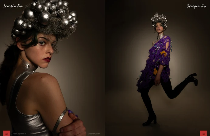 Model wearing a purple textured knit tunic and a metallic spherical headpiece against a dark gradient studio background.