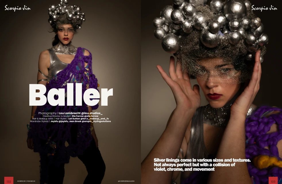 Editorial fashion shot features a woman in avant-garde silver and purple outfit and silver spherical headpiece against a studio backdrop.