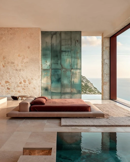 Luxurious bedroom with platform bed opens to an outdoor infinity pool, showcasing a scenic ocean view, stone textures, and serene setting.
