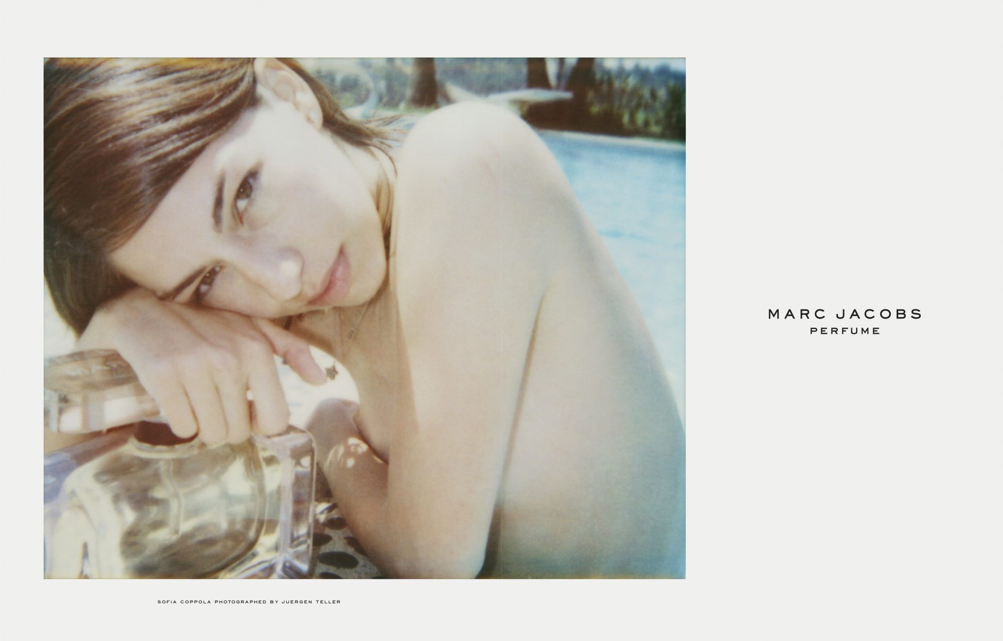 Sofia Coppola for Marc Jacobs perfume, features woman reclining near pool with product, sunlight, poolside setting, and light color palette.