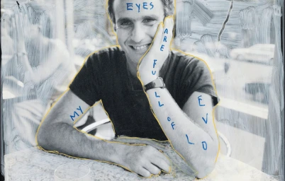 Portrait of a man with handwritten blue ink text by Jim Goldberg