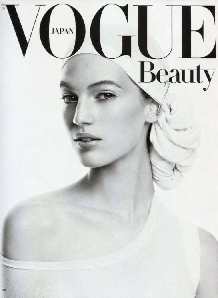 Vogue Japan beauty cover featuring a portrait of an adult female model with a white headscarf against a light background.