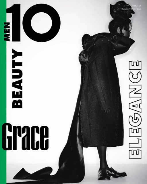 Editorial fashion shot of a woman in dramatic dark coat and headpiece on a white background with magazine cover-style graphics and text.
