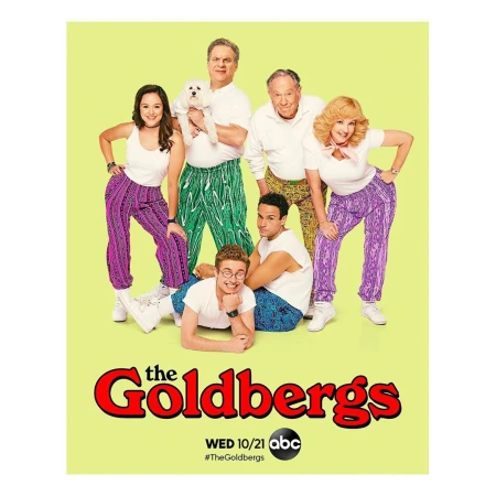 Promotional image for TV series The Goldbergs featuring seven adults in patterned 80's clothing with a yellow background and show title.