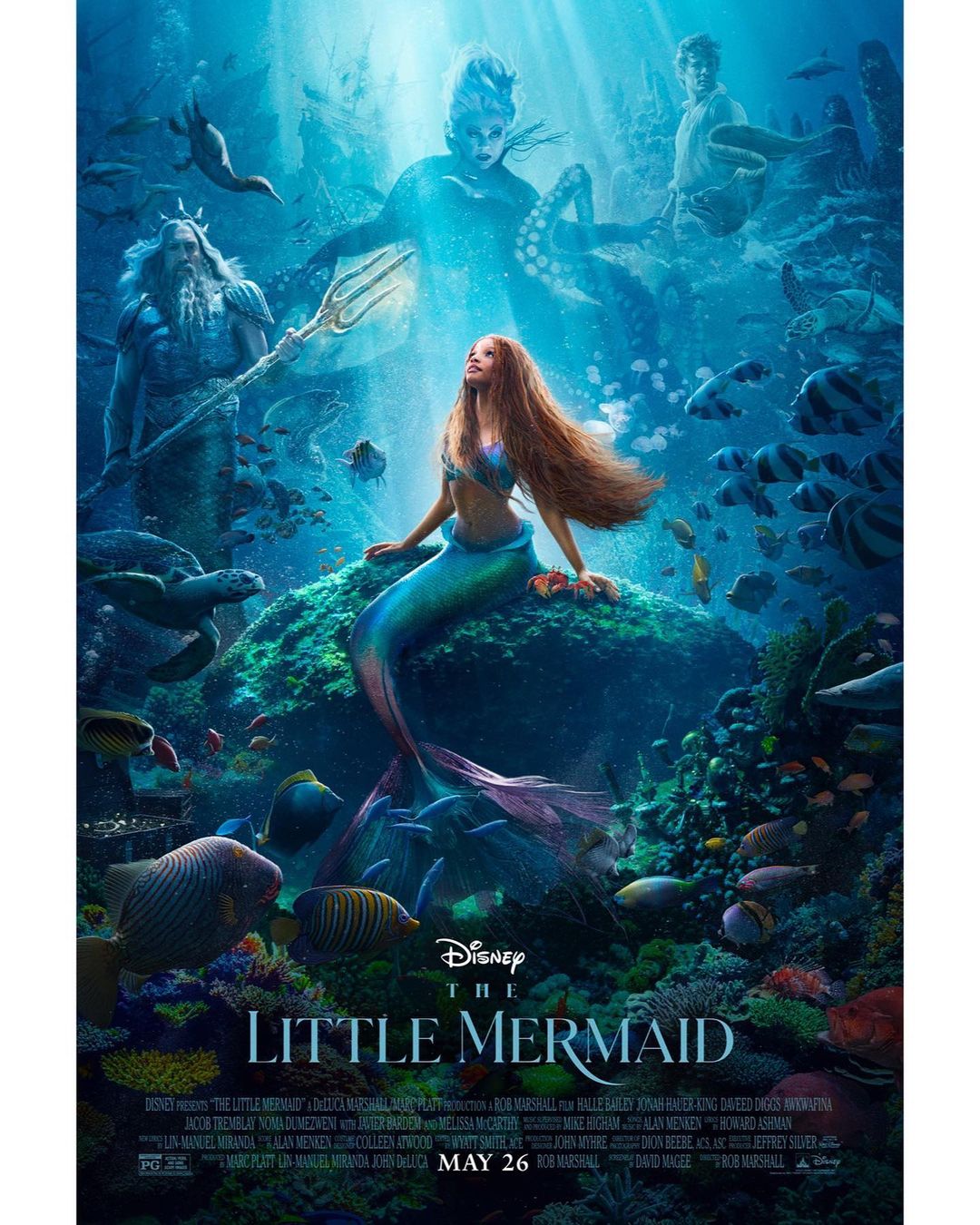 Movie poster for The Little Mermaid featuring a mermaid sitting on a rock with fish, sea turtles, and other sea creatures.