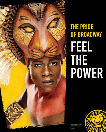 A stage performer with a lion headdress is shown in a promotional shot for The Lion King on Broadway. The performer has orange body paint.