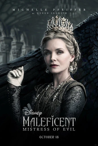 Michelle Pfeiffer as Queen Ingrith in 'Maleficent: Mistress of Evil', wearing a crown and embellished dress, with dark bird-like wings in the background.