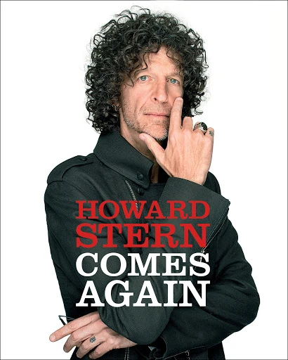 Portrait of Howard Stern on the cover of 'Comes Again,' wearing a black jacket against a white background with his hand to his face.