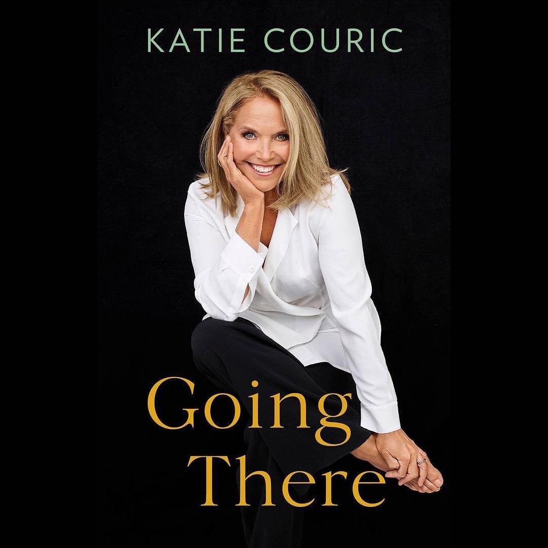 Portrait of Katie Couric against a black backdrop; book cover with gold text "Going There"; wearing a white blazer and black pants.