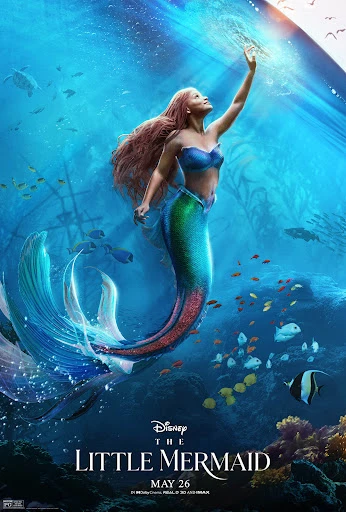Movie poster for Disney's The Little Mermaid featuring Halle Bailey as Ariel reaching for the light in an underwater scene with marine life.