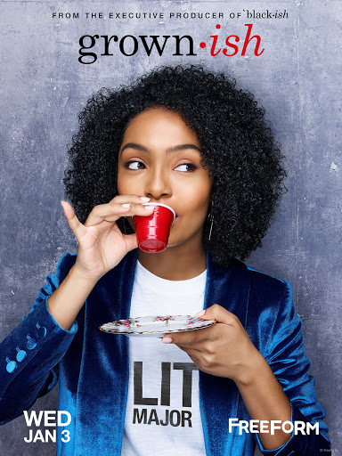 Yara Shahidi sips from a red plastic cup while holding a saucer in a promotional shot for the TV show Grown-ish against a grey background.