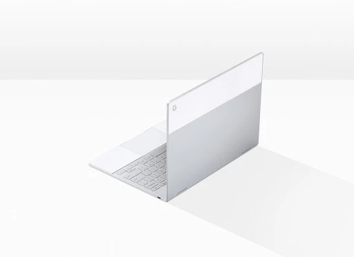 Sleek, partially opened, two-tone silver and white laptop on a white surface casting a light shadow, tech industry aesthetic.